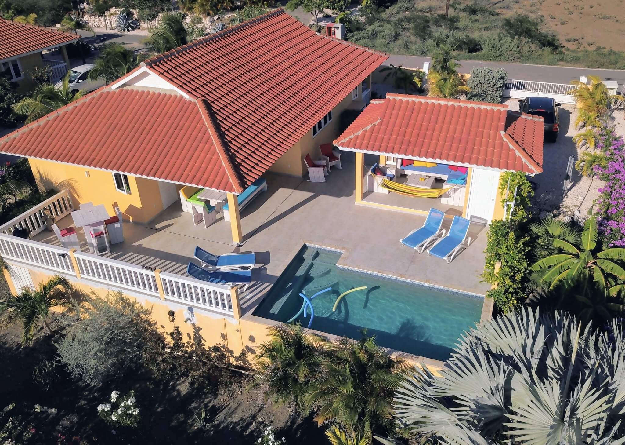 Aerial view of Kas Tribon with the terrace, the swimming pool and the garden, green hills behind